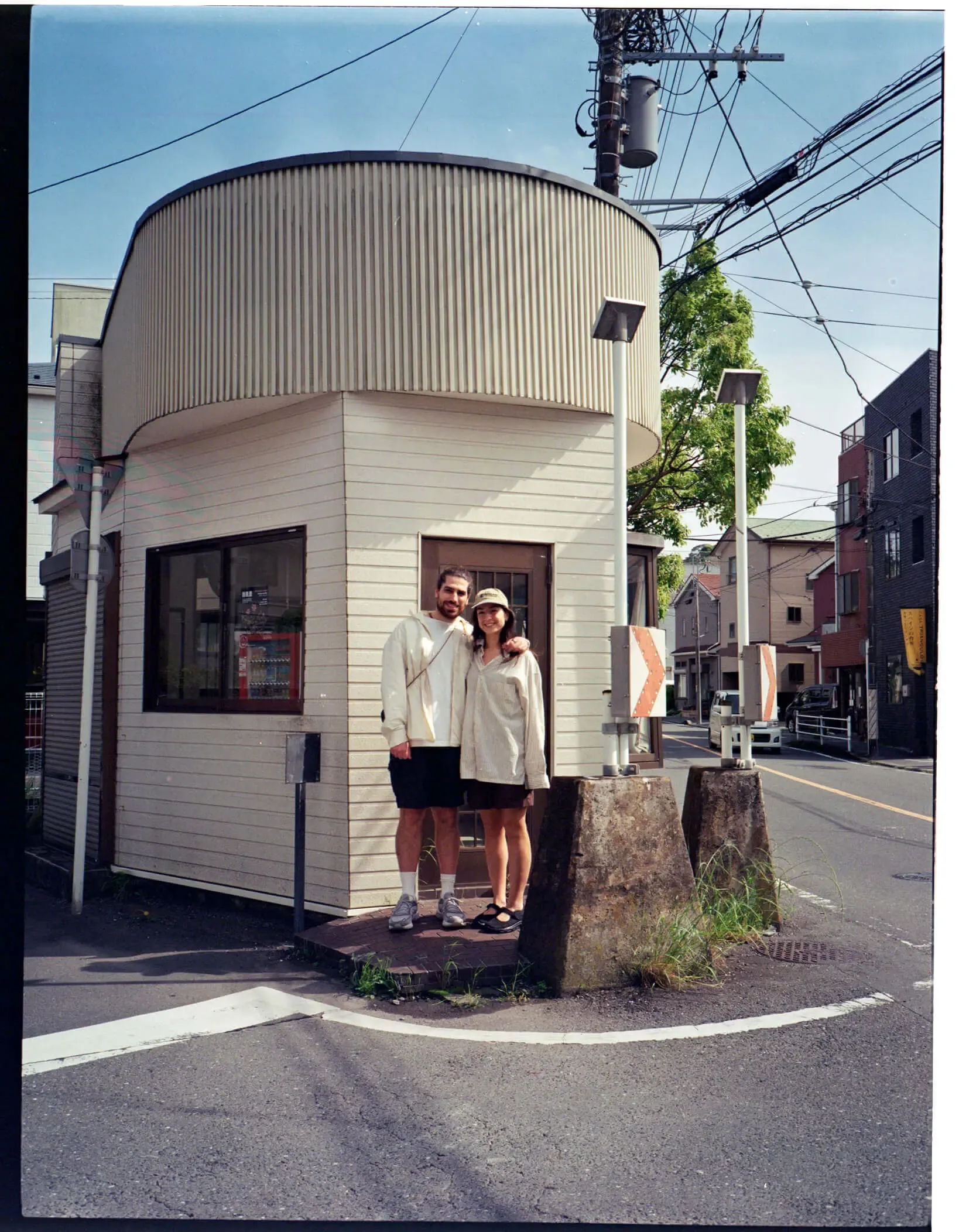 Burcu and her partner outside the former police box that became Pide